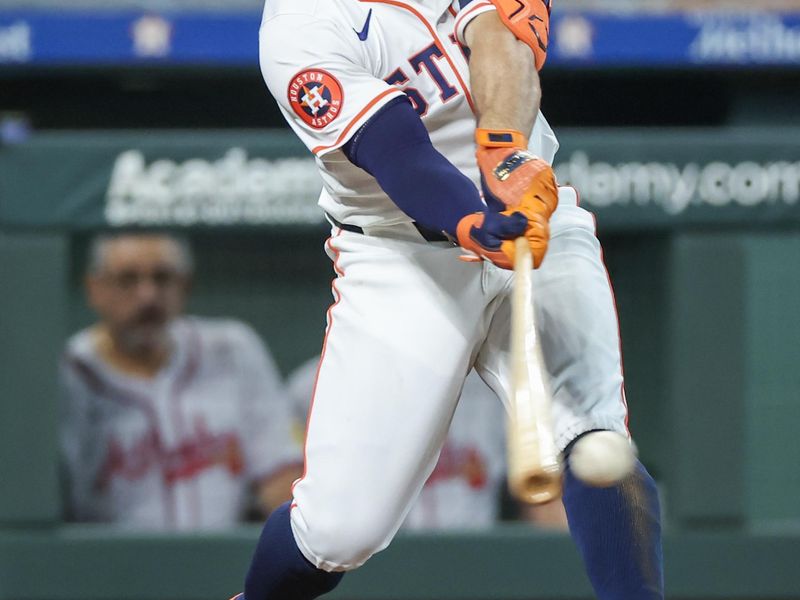 Apr 17, 2024; Houston, Texas, USA; Houston Astros second baseman Jose Altuve (27) hits a single against the Atlanta Braves in the fifth inning at Minute Maid Park. Mandatory Credit: Thomas Shea-USA TODAY Sports