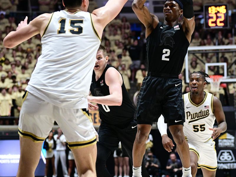 Mar 2, 2024; West Lafayette, Indiana, USA; Michigan State Spartans guard Tyson Walker (2) shoots the ball over Purdue Boilermakers center Zach Edey (15) during the first half at Mackey Arena. Mandatory Credit: Marc Lebryk-USA TODAY Sports