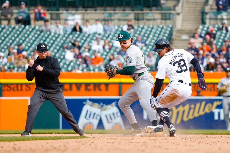 Apr 7, 2024; Detroit, Michigan, USA; Detroit Tigers third baseman Zach McKinstry (39) is called out at second base during the game against the Oakland Athletics at Comerica Park. Mandatory Credit: Brian Bradshaw Sevald-USA TODAY Sports