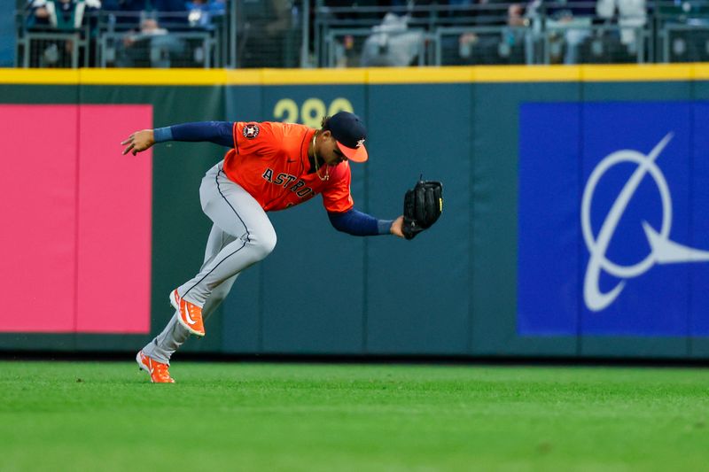 Apr 8, 2025; Seattle, Washington, USA; Houston Astros right fielder Cam Smith (11) catches a line drive against the Seattle Mariners during the first inning at T-Mobile Park. Mandatory Credit: Joe Nicholson-Imagn Images