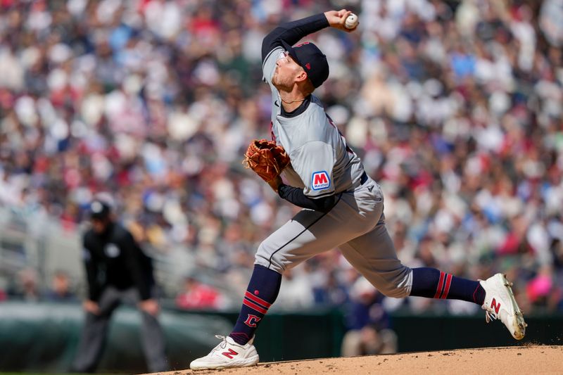 Apr 4, 2024; Minneapolis, Minnesota, USA; Cleveland Guardians starting pitcher Tanner Bibee (28) delivers a pitch during the first inning against the Minnesota Twins at Target Field. Mandatory Credit: Jordan Johnson-USA TODAY Sports