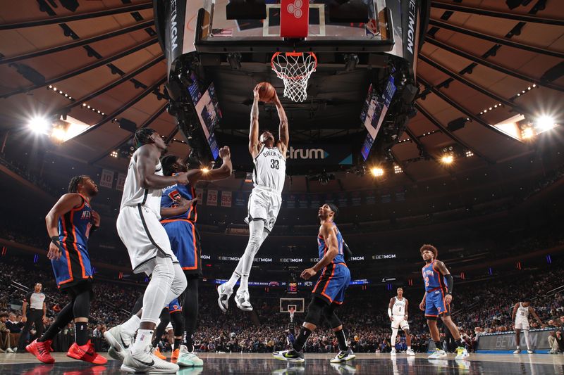 NEW YORK, NY - MARCH 23: Nicolas Claxton #33 of the Brooklyn Nets dunks the ball during the game against the New York Knicks on March 23, 2024 at Madison Square Garden in New York City, New York.  NOTE TO USER: User expressly acknowledges and agrees that, by downloading and or using this photograph, User is consenting to the terms and conditions of the Getty Images License Agreement. Mandatory Copyright Notice: Copyright 2024 NBAE  (Photo by Nathaniel S. Butler/NBAE via Getty Images)