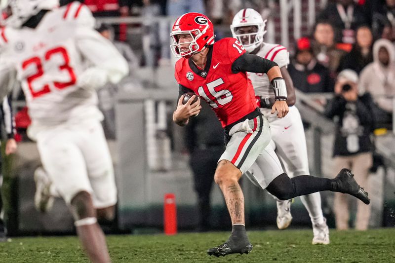 Nov 11, 2023; Athens, Georgia, USA; A Georgia Bulldogs quarterback Carson Beck (15) runs with the ball against the Mississippi Rebels during the second half at Sanford Stadium. Mandatory Credit: Dale Zanine-USA TODAY Sports