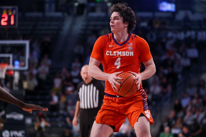 Feb 21, 2024; Atlanta, Georgia, USA; Clemson Tigers forward Ian Schieffelin (4) handles the ball against the Georgia Tech Yellow Jackets in the first half at McCamish Pavilion. Mandatory Credit: Brett Davis-USA TODAY Sports
