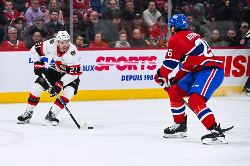 Jan 23, 2024; Montreal, Quebec, CAN; Ottawa Senators right wing Mathieu Joseph (21) plays the puck against Montreal Canadiens defenseman Johnathan Kovacevic (26) during the first period at Bell Centre. Mandatory Credit: David Kirouac-USA TODAY Sports