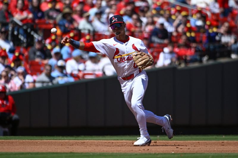 Apr 21, 2024; St. Louis, Missouri, USA; St. Louis Cardinals shortstop Masyn Winn (0) throws to first for an out against the Milwaukee Brewers in the fourth inning at Busch Stadium. Mandatory Credit: Joe Puetz-USA TODAY Sports