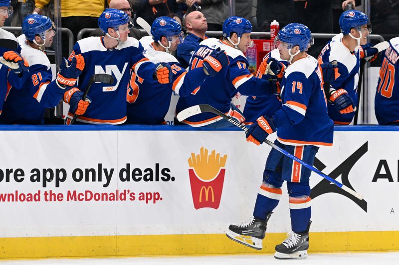 Mar 5, 2024; Elmont, New York, USA;  New York Islanders center Bo Horvat (14) celebrates with teammates after a goal during the third period against the St. Louis Blues at UBS Arena. Mandatory Credit: Dennis Schneidler-USA TODAY Sports