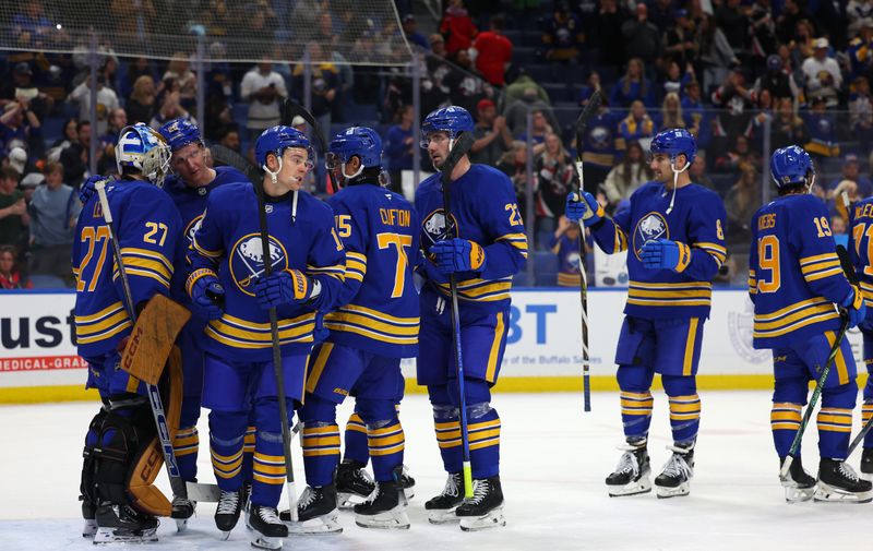 Oct 12, 2024; Buffalo, New York, USA;  The Buffalo Sabres celebrate a win over the Florida Panthers at KeyBank Center. Mandatory Credit: Timothy T. Ludwig-Imagn Images