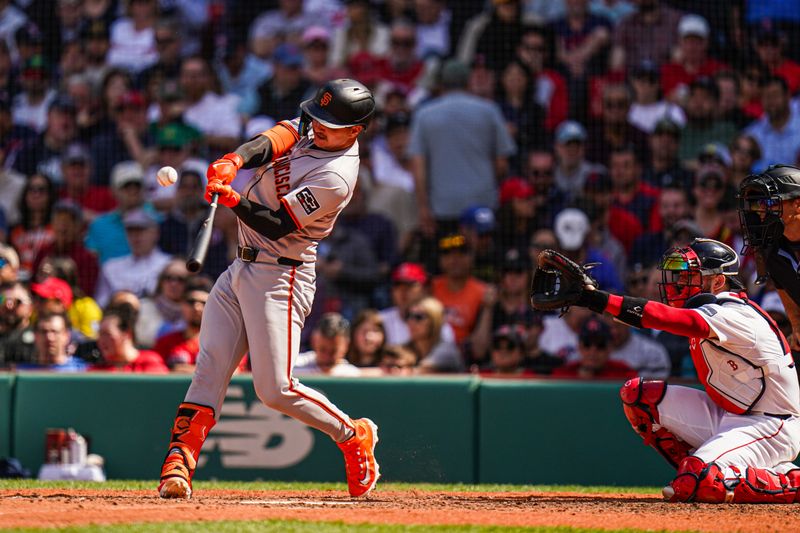 May 2, 2024; Boston, Massachusetts, USA; San Francisco Giants catcher Patrick Bailey (14) gets a base hit against the Boston Red Sox in the seventh inning at Fenway Park. Mandatory Credit: David Butler II-USA TODAY Sports