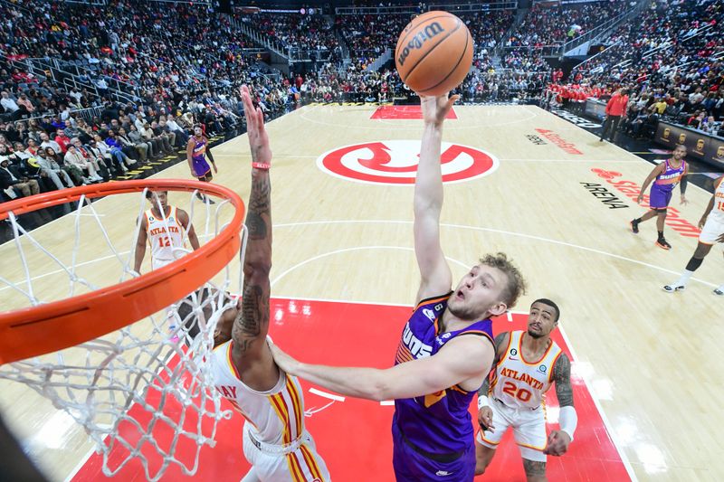 ATLANTA, GA - FEBUARY 9: Jock Landale #11 of the Phoenix Suns goes to the basket during the game  on Febuary 9, 2023 at State Farm Arena in Atlanta, Georgia.  NOTE TO USER: User expressly acknowledges and agrees that, by downloading and/or using this Photograph, user is consenting to the terms and conditions of the Getty Images License Agreement. Mandatory Copyright Notice: Copyright 2023 NBAE (Photo by Adam Hagy/NBAE via Getty Images)