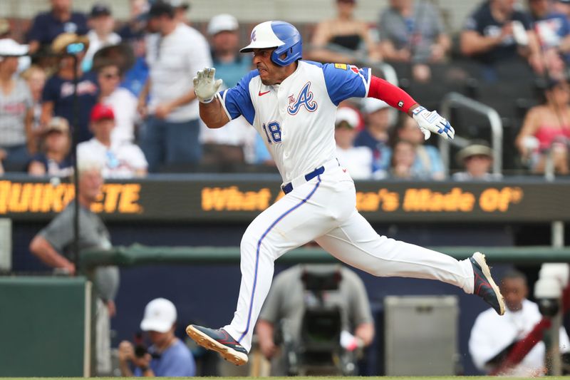 Jun 15, 2024; Cumberland, Georgia, USA; Atlanta Braves right fielder Ramon Laureano (18) runs to home against the Tampa Bay Rays during the eighth inning at Truist Park. Mandatory Credit: Mady Mertens-USA TODAY Sports