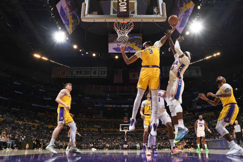 LOS ANGELES, CA - NOVEMBER 8: Anthony Davis #3 of the Los Angeles Lakers goes up for the rebound during the game against the Philadelphia 76ers on Novemberr 8, 2024 at Crypto.Com Arena in Los Angeles, California. NOTE TO USER: User expressly acknowledges and agrees that, by downloading and/or using this Photograph, user is consenting to the terms and conditions of the Getty Images License Agreement. Mandatory Copyright Notice: Copyright 2024 NBAE (Photo by Adam Pantozzi/NBAE via Getty Images)