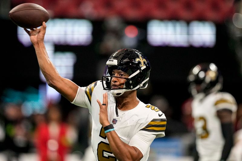 New Orleans Saints quarterback Jameis Winston (2) warms up before an NFL football game against the Atlanta Falcons, Sunday, Nov. 26, 2023, in Atlanta. (AP Photo/Brynn Anderson)