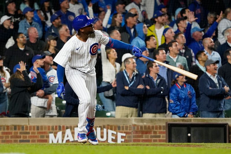 Sep 19, 2023; Chicago, Illinois, USA; Chicago Cubs designated hitter Alexander Canario (4) hits a grand slam home run against the Pittsburgh Pirates during the eighth inning at Wrigley Field. Mandatory Credit: David Banks-USA TODAY Sports