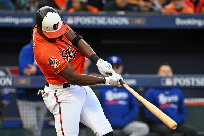 Oct 8, 2023; Baltimore, Maryland, USA; Baltimore Orioles shortstop Jorge Mateo (3) hits a double during the third inning against the Texas Rangers during game two of the ALDS for the 2023 MLB playoffs at Oriole Park at Camden Yards. Mandatory Credit: Tommy Gilligan-USA TODAY Sports