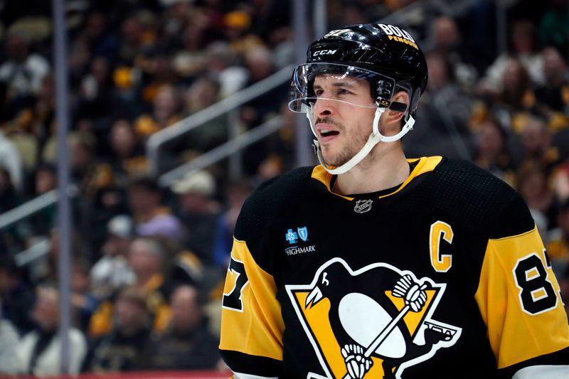 Mar 10, 2024; Pittsburgh, Pennsylvania, USA;  Pittsburgh Penguins center Sidney Crosby (87) looks on against the Edmonton Oilers during the second period at PPG Paints Arena. Mandatory Credit: Charles LeClaire-USA TODAY Sports