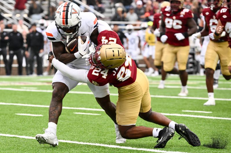 Sep 30, 2023; Chestnut Hill, Massachusetts, USA; Boston College Eagles cornerback Amari Jackson (24) tackles Virginia Cavaliers wide receiver Malik Washington (4) during the first half at Alumni Stadium. Mandatory Credit: Brian Fluharty-USA TODAY Sports