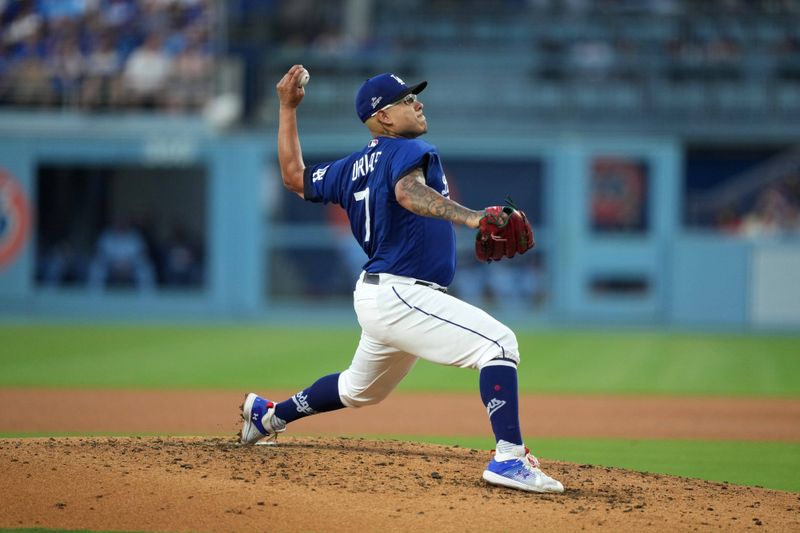 Jul 25, 2023; Los Angeles, California, USA; Los Angeles Dodgers starting pitcher Julio Urias (7) throws in the third inning against the Toronto Blue Jays at Dodger Stadium. Mandatory Credit: Kirby Lee-USA TODAY Sports