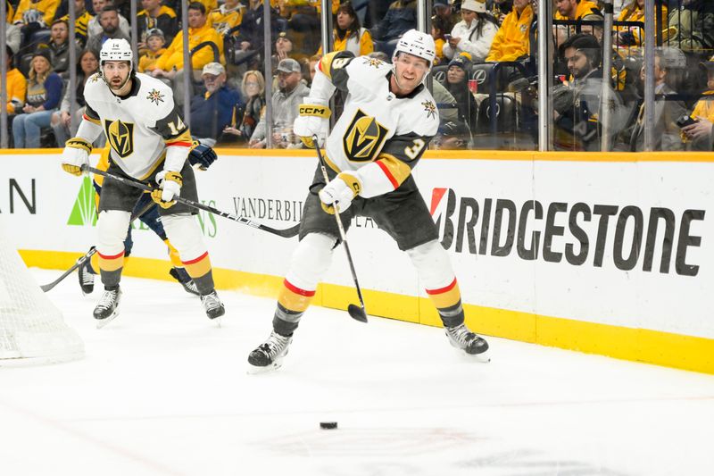 Jan 14, 2025; Nashville, Tennessee, USA;  Vegas Golden Knights defenseman Brayden McNabb (3) clears the puck against the Nashville Predators during the first period at Bridgestone Arena. Mandatory Credit: Steve Roberts-Imagn Images