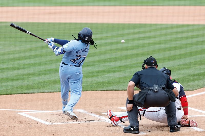 May 5, 2024; Washington, District of Columbia, USA; Toronto Blue Jays first baseman Vladimir Guerrero Jr. (27) singles against the Washington Nationals during the first inning at Nationals Park. Mandatory Credit: Geoff Burke-USA TODAY Sports