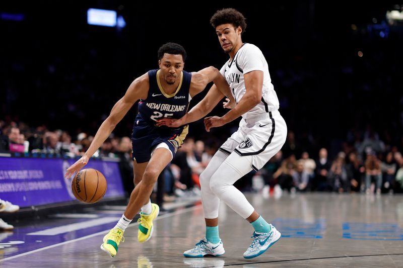 NEW YORK, NEW YORK - MARCH 19: Trey Murphy III #25 of the New Orleans Pelicans dribbles against Cameron Johnson #2 of the Brooklyn Nets during the first half at Barclays Center on March 19, 2024 in the Brooklyn borough of New York City. NOTE TO USER: User expressly acknowledges and agrees that, by downloading and/or using this Photograph, user is consenting to the terms and conditions of the Getty Images License Agreement. (Photo by Sarah Stier/Getty Images)