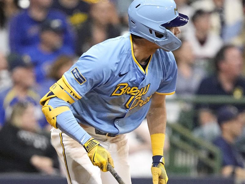 May 31, 2024; Milwaukee, Wisconsin, USA;  Milwaukee Brewers left fielder Christian Yelich (22) hits tow RBI double during the seventh inning against the Chicago White Sox at American Family Field. Mandatory Credit: Jeff Hanisch-USA TODAY Sports