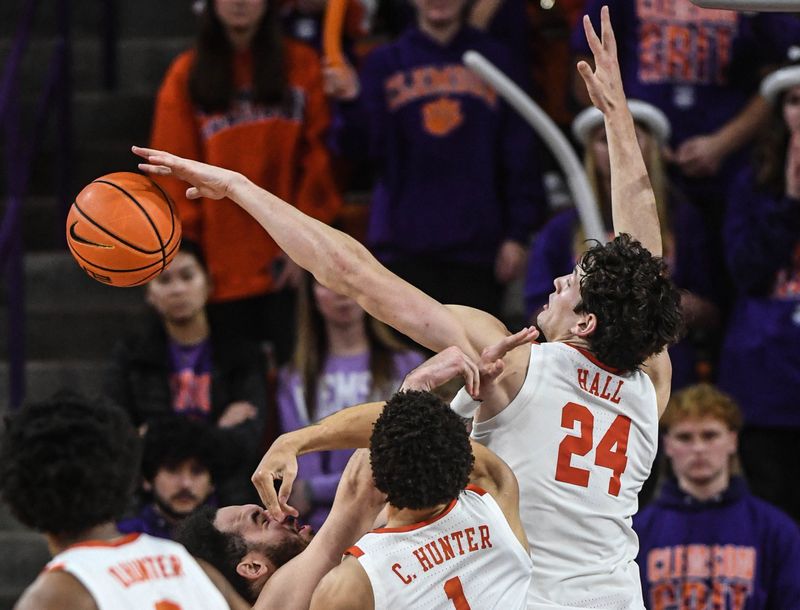 Jan 13, 2024; Clemson, South Carolina, USA; Clemson Tigers forward PJ Hall (24) blocks s shot by Boston College Eagles forward Elijah Strong (31) during the second half at Littlejohn Coliseum. Mandatory Credit: Ken Ruinard-USA TODAY Sports