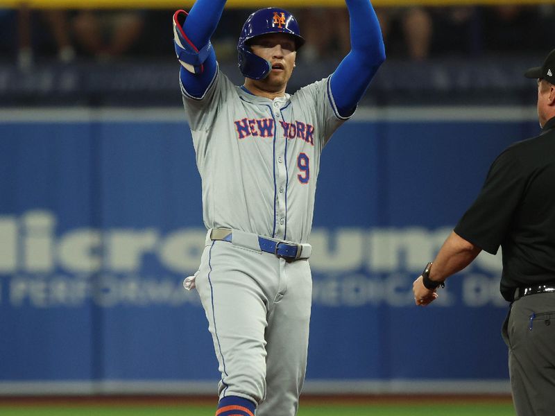 May 4, 2024; St. Petersburg, Florida, USA;  New York Mets outfielder Brandon Nimmo (9) celebrates after he doubles against the Tampa Bay Rays during the first inning at Tropicana Field. Mandatory Credit: Kim Klement Neitzel-USA TODAY Sports