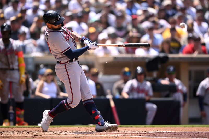 Apr 19, 2023; San Diego, California, USA; Atlanta Braves left fielder Kevin Pillar (17) hits a single against the San Diego Padres during the third inning at Petco Park. Mandatory Credit: Orlando Ramirez-USA TODAY Sports