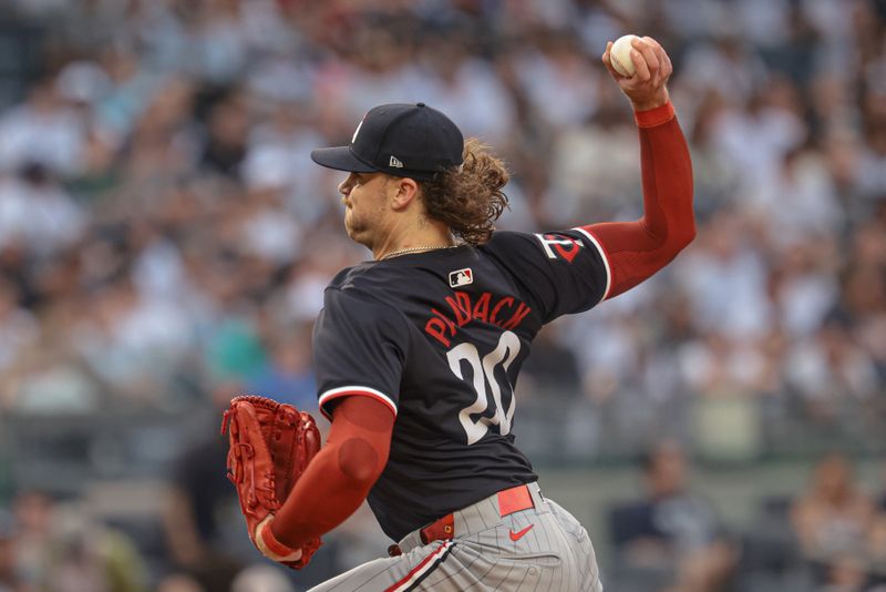 Jun 5, 2024; Bronx, New York, USA; Minnesota Twins starting pitcher Chris Paddack (20) delivers a pitch during the first inning against the New York Yankees at Yankee Stadium. Mandatory Credit: Vincent Carchietta-USA TODAY Sports