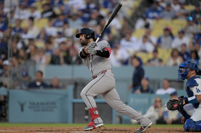 May 21, 2025; Los Angeles, California, USA; Arizona Diamondbacks third baseman Eugenio Suarez (28) singles during the second inning against the Los Angeles Dodgers at Dodger Stadium. Mandatory Credit: Jayne Kamin-Oncea-Imagn Images