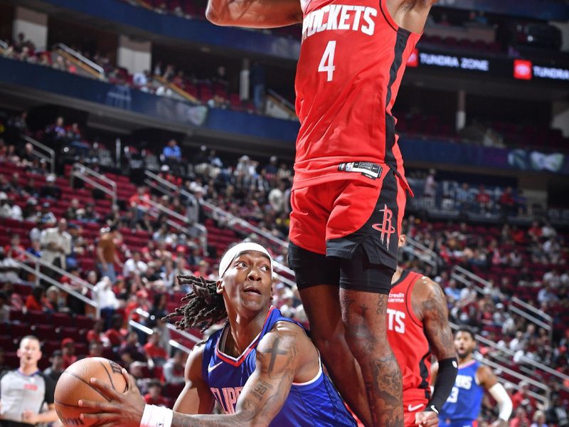 HOUSTON, TX - MARCH 6: Terance Mann #14 of the LA Clippers handles the ball during the game against the Houston Rockets on March 6, 2024 at the Toyota Center in Houston, Texas. NOTE TO USER: User expressly acknowledges and agrees that, by downloading and or using this photograph, User is consenting to the terms and conditions of the Getty Images License Agreement. Mandatory Copyright Notice: Copyright 2024 NBAE (Photo by Logan Riely/NBAE via Getty Images)