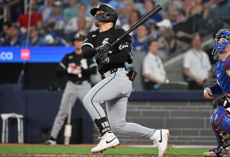 May 21, 2024; Toronto, Ontario, CAN;  Chicago White Sox third baseman Danny Mendick (0) hits a two RBI double against the Toronto Blue Jays in the eighth inning at Rogers Centre. Mandatory Credit: Dan Hamilton-USA TODAY Sports