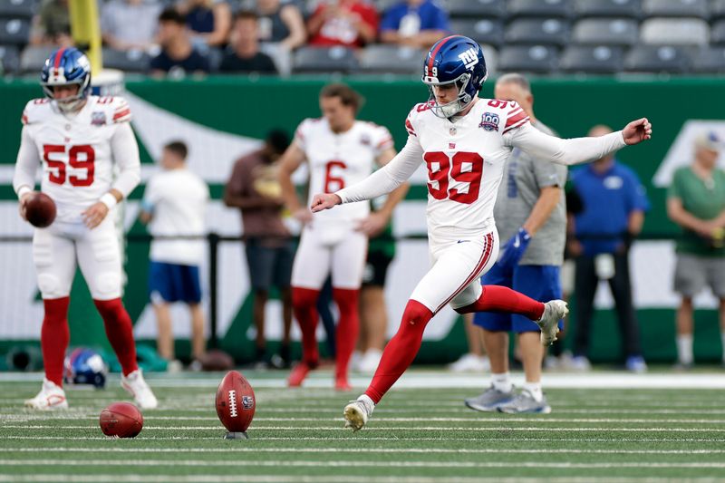 New York Giants place kicker Jude McAtamney (99) warms up before a preseason NFL football game against the New York Jets Saturday, Aug. 24, 2024, in East Rutherford, N.J. (AP Photo/Adam Hunger)