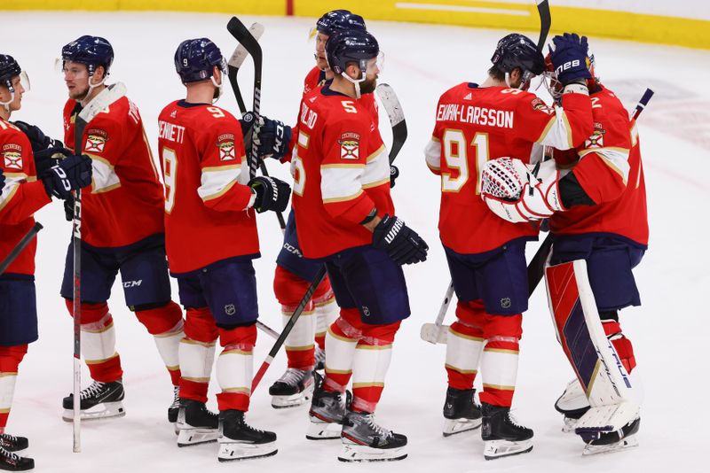 Apr 21, 2024; Sunrise, Florida, USA; Florida Panthers goaltender Sergei Bobrovsky (72) celebrates with defenseman Oliver Ekman-Larsson (91) after defeating the Tampa Bay Lightning in game one of the first round of the 2024 Stanley Cup Playoffs at Amerant Bank Arena. Mandatory Credit: Sam Navarro-USA TODAY Sports