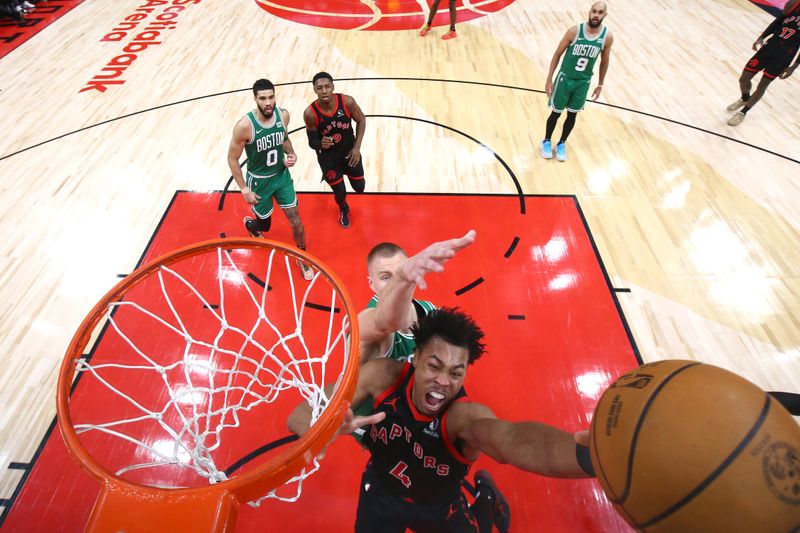 TORONTO, CANADA - JANUARY 15:  Scottie Barnes #4 of the Toronto Raptors drives to the basket during the game against the Boston Celtics on January 15, 2024 at the Scotiabank Arena in Toronto, Ontario, Canada.  NOTE TO USER: User expressly acknowledges and agrees that, by downloading and or using this Photograph, user is consenting to the terms and conditions of the Getty Images License Agreement.  Mandatory Copyright Notice: Copyright 2024 NBAE (Photo by Vaughn Ridley/NBAE via Getty Images)