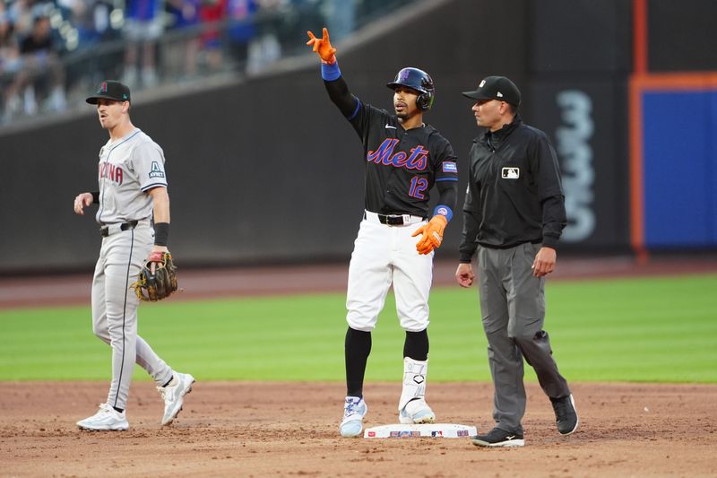 May 31, 2024; New York City, New York, USA; New York Mets shortstop Francisco Lindor (12) reacts to hitting an RBI double against the Arizona Diamondbacks during the second inning at Citi Field. Mandatory Credit: Gregory Fisher-USA TODAY Sports