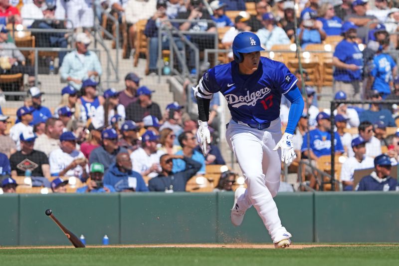 Mar 6, 2025; Phoenix, Arizona, USA; Los Angeles Dodgers two-way player Shohei Ohtani (17) runs to first en route to a  double against the Texas Rangers during the first inning at Camelback Ranch-Glendale. Mandatory Credit: Joe Camporeale-Imagn Images