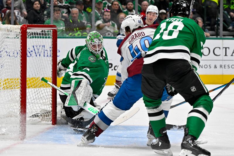 Jan 4, 2024; Dallas, Texas, USA; Dallas Stars goaltender Scott Wedgewood (41) stops a shot by Colorado Avalanche defenseman Samuel Girard (49) during the first period at the American Airlines Center. Mandatory Credit: Jerome Miron-USA TODAY Sports