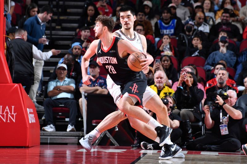 HOUSTON, TX - JANUARY 13:  Alperen Sengun #28 of the Houston Rockets dribbles the ball during the game against the Memphis Grizzlies  on January 13, 2025 at the Toyota Center in Houston, Texas. NOTE TO USER: User expressly acknowledges and agrees that, by downloading and or using this photograph, User is consenting to the terms and conditions of the Getty Images License Agreement. Mandatory Copyright Notice: Copyright 2024 NBAE (Photo by Logan Riely/NBAE via Getty Images)