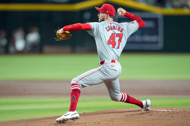 Jun 13, 2024; Phoenix, Arizona, USA; Los Angeles Angels pitcher Griffin Canning (47) pitches against the Arizona Diamondbacks during the first inning at Chase Field. Mandatory Credit: Joe Camporeale-USA TODAY Sports