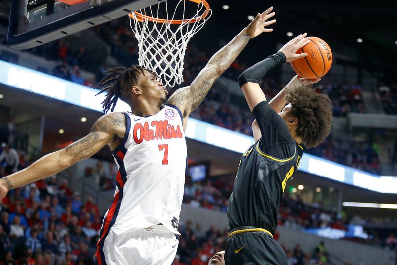 Feb 17, 2024; Oxford, Mississippi, USA; Missouri Tigers forward Jordan Butler (0) shoots as Mississippi Rebels guard Allen Flanigan (7) defends during the first half at The Sandy and John Black Pavilion at Ole Miss. Mandatory Credit: Petre Thomas-USA TODAY Sports