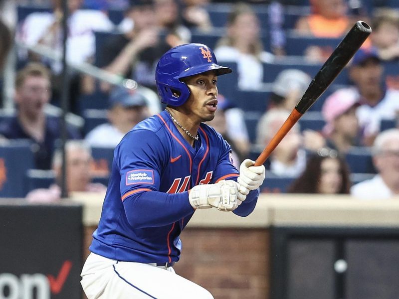 Jun 26, 2024; New York City, New York, USA;  New York Mets shortstop Francisco Lindor (12) hits a double in the third inning against the New York Yankees at Citi Field. Mandatory Credit: Wendell Cruz-USA TODAY Sports