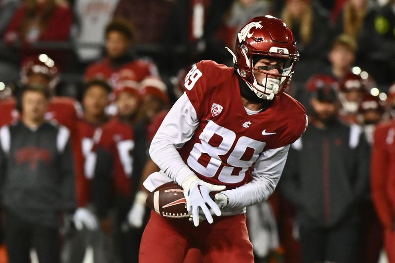 Nov 26, 2022; Pullman, Washington, USA; Washington State Cougars wide receiver Leyton Smithson (89) makes a catch against the Washington Huskies in first half at Gesa Field at Martin Stadium. Mandatory Credit: James Snook-USA TODAY Sports