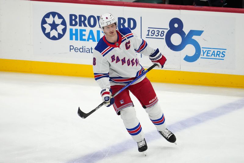 Dec 29, 2023; Sunrise, Florida, USA; New York Rangers defenseman Jacob Trouba (8) skates on the ice prior to the game against the Florida Panthers at Amerant Bank Arena. Mandatory Credit: Jasen Vinlove-USA TODAY Sports