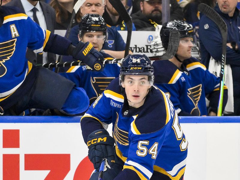 Dec 17, 2025; St. Louis, Missouri, USA; St. Louis Blues right wing Dalibor Dvorsky (54) controls the puck against the Winnipeg Jets during the second period at Enterprise Center. Mandatory Credit: Jeff Curry-Imagn Images