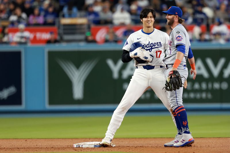 Apr 19, 2024; Los Angeles, California, USA;  Los Angeles Dodgers designated hitter Shohei Ohtani (17) reacts after stealing second base during the fourth inning against the New York Mets at Dodger Stadium. Mandatory Credit: Kiyoshi Mio-USA TODAY Sports