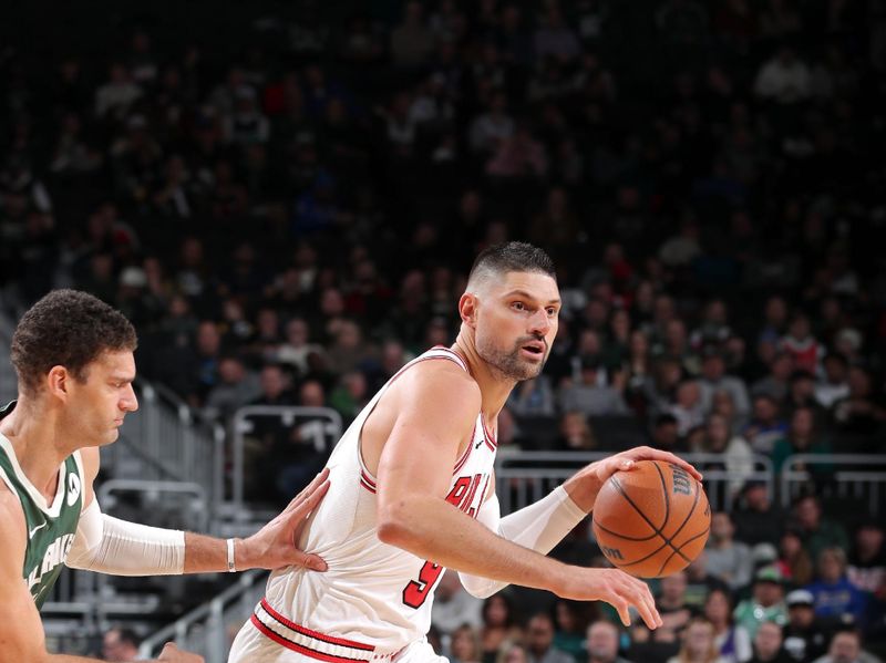 MILWAUKEE, WI - NOVEMBER 20: Nikola Vucevic #9 of the Chicago Bulls looks on during the game against the Milwaukee Bucks on November 20, 2024 at the Fiserv Forum Center in Milwaukee, Wisconsin. NOTE TO USER: User expressly acknowledges and agrees that, by downloading and or using this Photograph, user is consenting to the terms and conditions of the Getty Images License Agreement. Mandatory Copyright Notice: Copyright 2024 NBAE (Photo by Gary Dineen/NBAE via Getty Images).