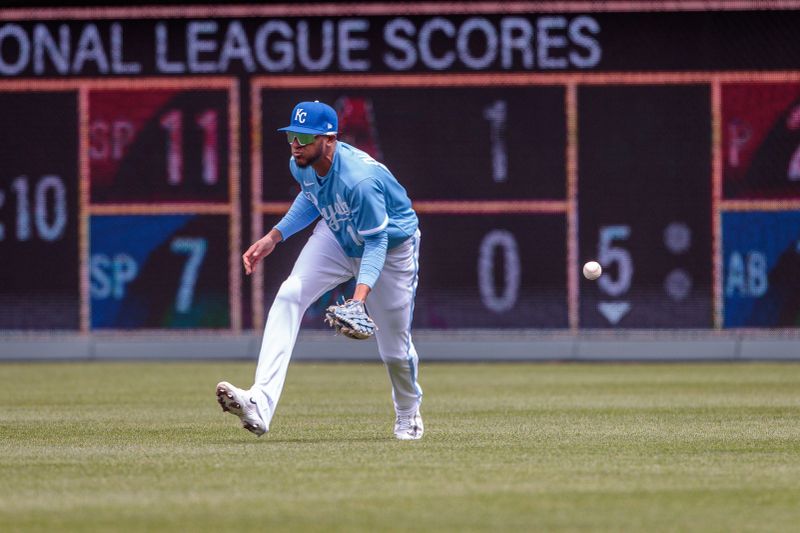 Apr 16, 2023; Kansas City, Missouri, USA; Kansas City Royals left fielder Edward Olivares (14) misses a ground ball during the third inning against the Atlanta Braves at Kauffman Stadium. Mandatory Credit: William Purnell-USA TODAY Sports