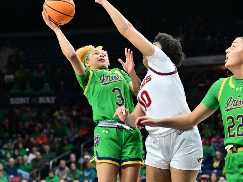 Feb 29, 2024; South Bend, Indiana, USA; Notre Dame Fighting Irish guard Hannah Hidalgo (3) goes up for a shot as Virginia Tech Hokies forward Carys Baker (10) defends in the second half at the Purcell Pavilion. Mandatory Credit: Matt Cashore-USA TODAY Sports